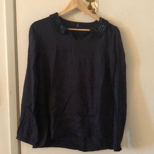 Black long sleeve top with bead accent on collar
